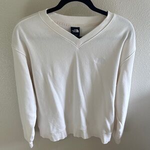 The North Face women’s  Off-White V-Neck Sweat shirt.